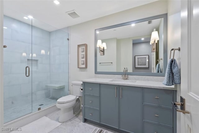 bathroom featuring vanity, toilet, a shower stall, marble finish floor, and visible vents