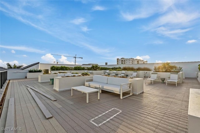 wooden deck featuring an outdoor living space