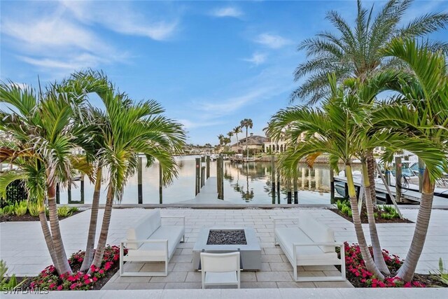 exterior space with an outdoor fire pit and a boat dock