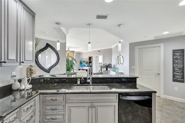 kitchen featuring sink, dishwasher, dark stone countertops, gray cabinetry, and decorative light fixtures