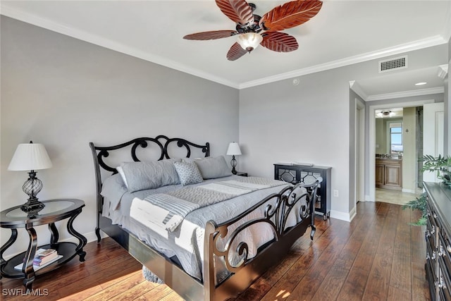 bedroom featuring dark hardwood / wood-style flooring, ornamental molding, and ceiling fan