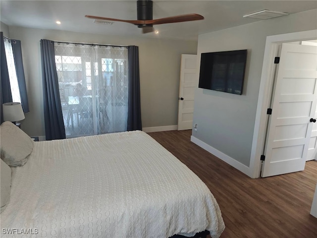 bedroom featuring dark wood-type flooring and ceiling fan