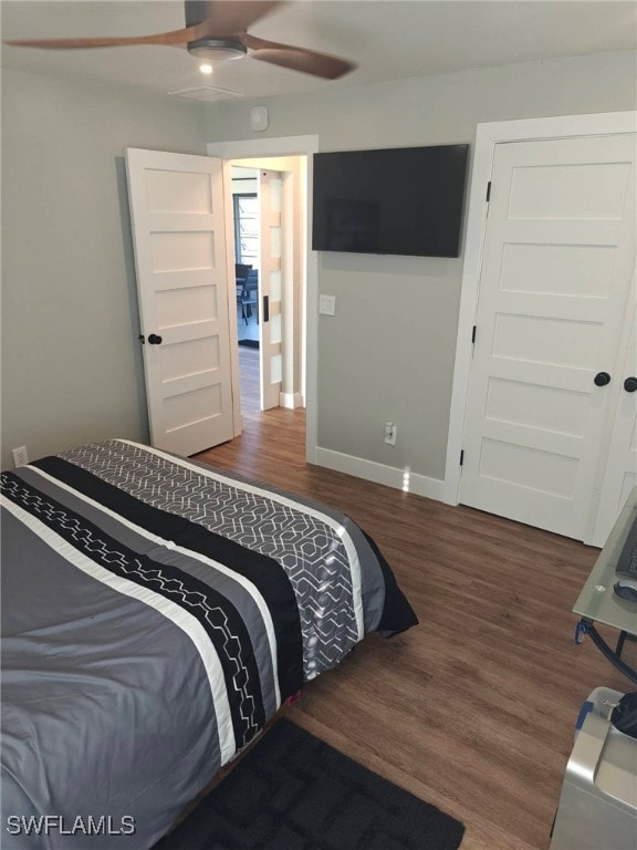 bedroom featuring dark wood-type flooring and ceiling fan