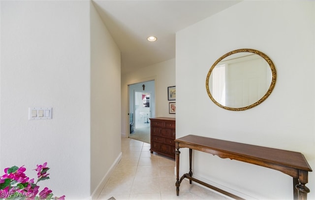 hall with light tile patterned flooring