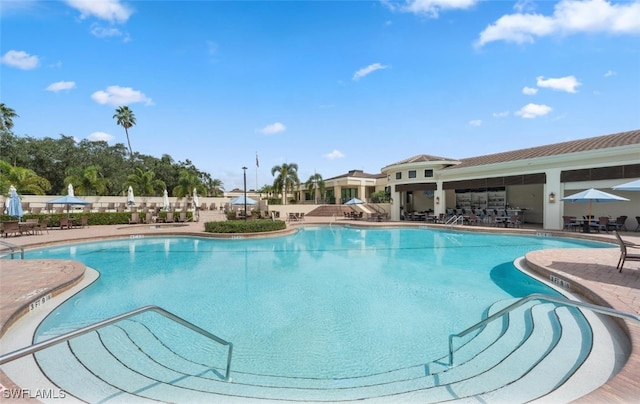 pool with a patio area
