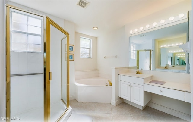 bathroom featuring shower with separate bathtub, tile patterned floors, and vanity