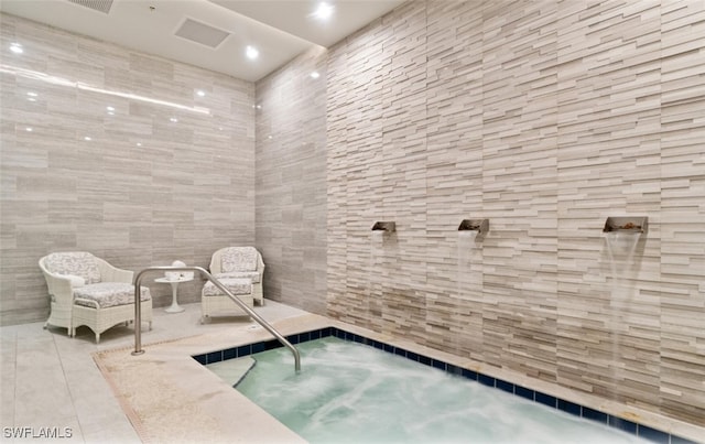 view of pool featuring an indoor hot tub