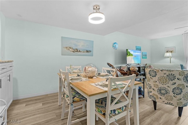 dining space featuring light wood-type flooring