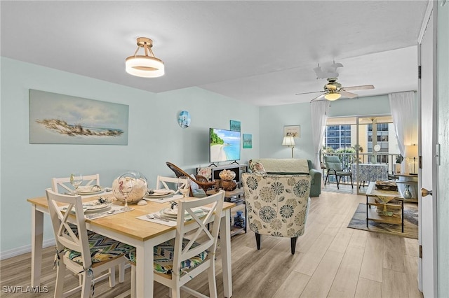 dining space featuring light hardwood / wood-style floors and ceiling fan