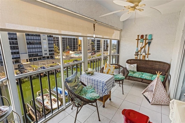 sunroom / solarium with ceiling fan