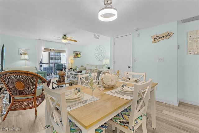 dining space featuring ceiling fan and light hardwood / wood-style flooring