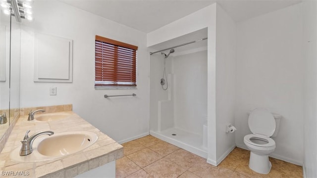 full bathroom featuring toilet, walk in shower, and a sink