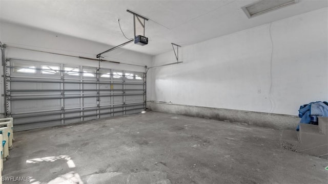 garage featuring a garage door opener