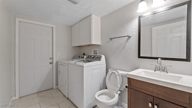 laundry room featuring marble finish floor, a sink, and independent washer and dryer