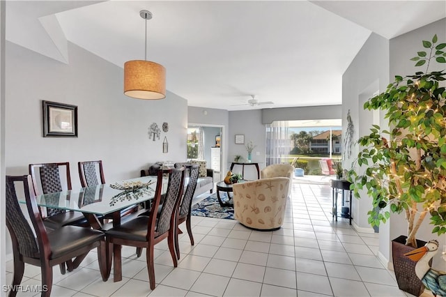 tiled dining space featuring ceiling fan