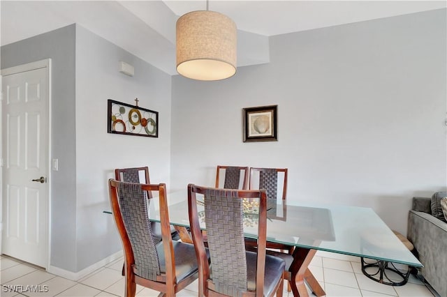 dining space featuring light tile patterned floors