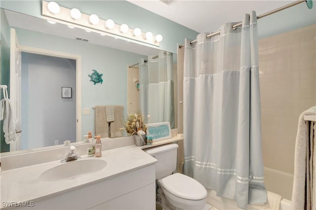 full bathroom with toilet, vanity, and shower / bath combo with shower curtain