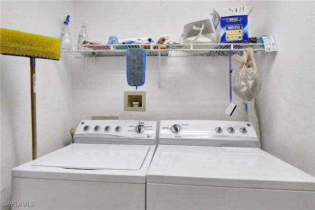 washroom with washing machine and dryer