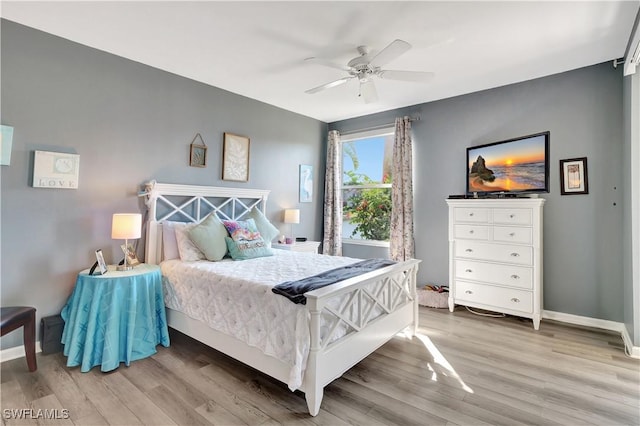 bedroom with wood-type flooring and ceiling fan