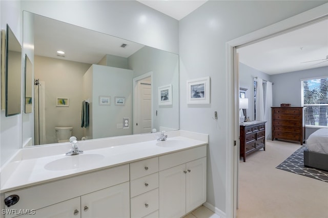 bathroom with vanity and toilet