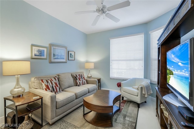 carpeted living room featuring ceiling fan