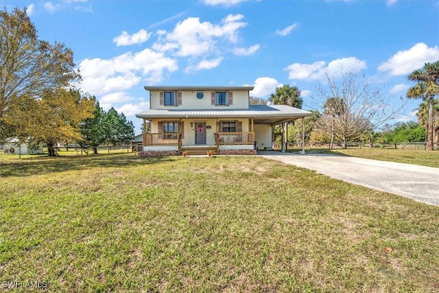 view of front of house with a porch, a carport, and a front yard