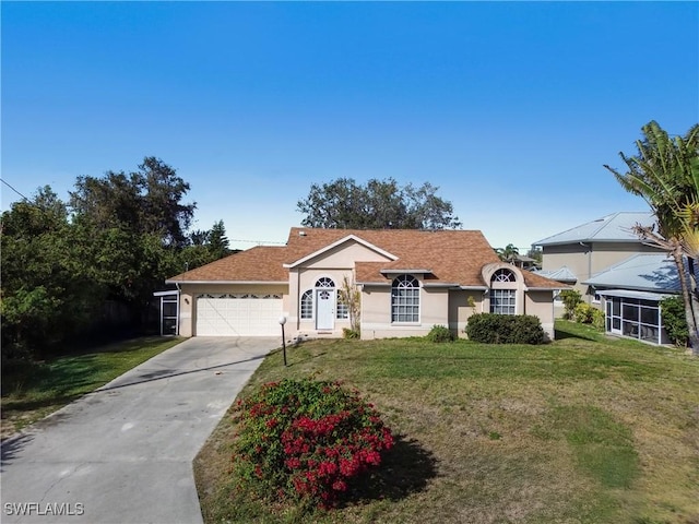 ranch-style house with a garage and a front lawn