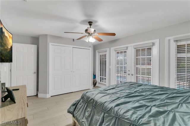 bedroom featuring french doors, a closet, ceiling fan, access to exterior, and light hardwood / wood-style floors