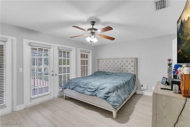 bedroom with french doors, access to outside, ceiling fan, and light hardwood / wood-style flooring