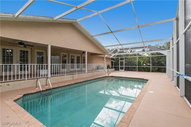 view of pool with a lanai, a patio area, and ceiling fan