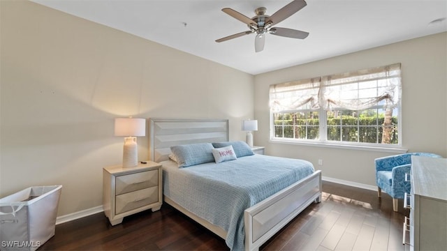 bedroom with dark hardwood / wood-style floors and ceiling fan