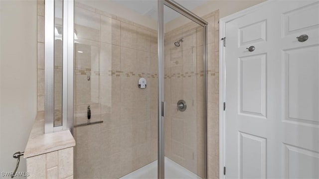 bathroom featuring a shower with door