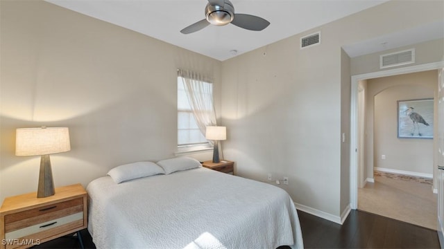 bedroom with dark wood-type flooring and ceiling fan