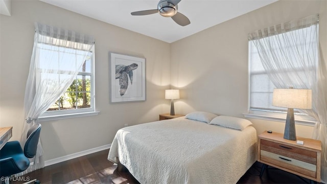 bedroom featuring dark hardwood / wood-style floors and ceiling fan