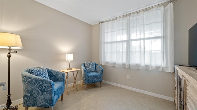 sitting room with light tile patterned floors