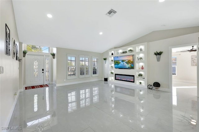 living room featuring lofted ceiling