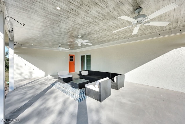 view of patio / terrace with ceiling fan and an outdoor living space