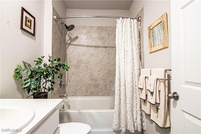 full bathroom with vanity, shower / bath combination with curtain, and toilet