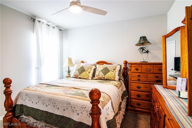 bedroom featuring ceiling fan, carpet flooring, and multiple windows