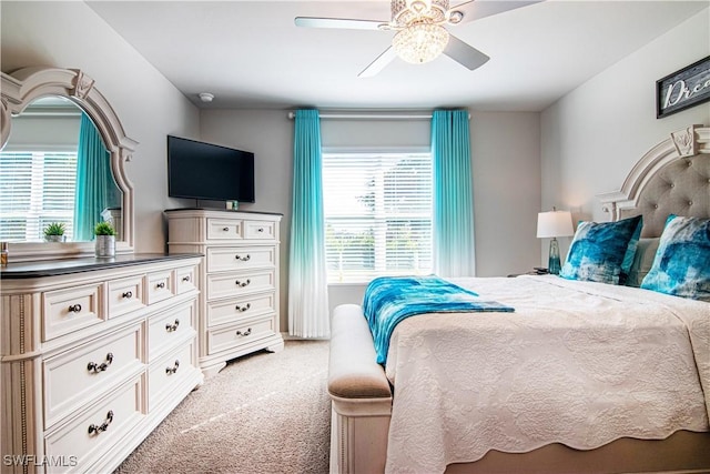 carpeted bedroom with ceiling fan