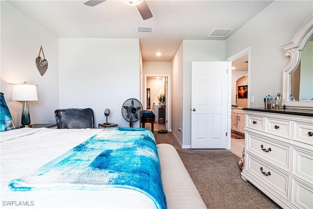 bedroom with ceiling fan and dark colored carpet