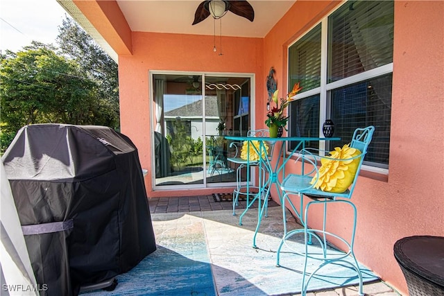 view of patio featuring ceiling fan and grilling area