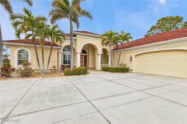 mediterranean / spanish house featuring a garage