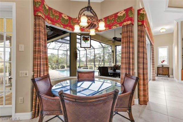 dining space featuring crown molding, plenty of natural light, light tile patterned floors, and ceiling fan