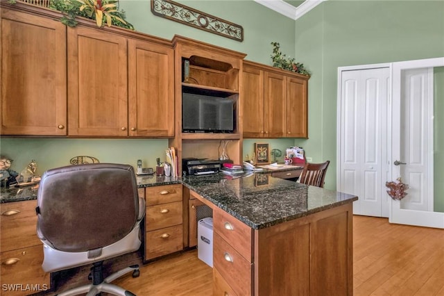 office space with crown molding and light hardwood / wood-style flooring