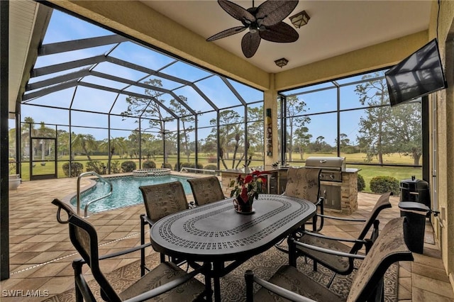 view of patio / terrace featuring ceiling fan, a grill, and glass enclosure