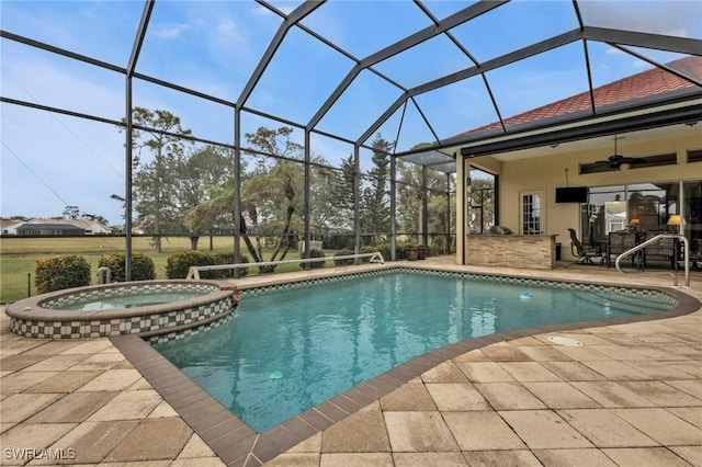 view of pool featuring an in ground hot tub, ceiling fan, a patio, and glass enclosure