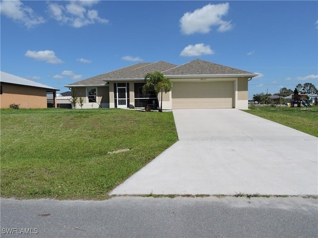 view of front facade featuring a garage and a front lawn