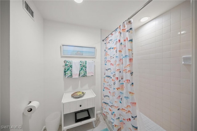 full bathroom with visible vents and a tile shower