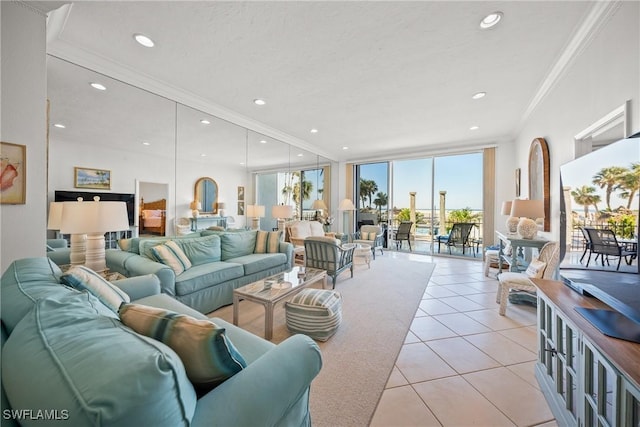 living room with ornamental molding and light tile patterned floors